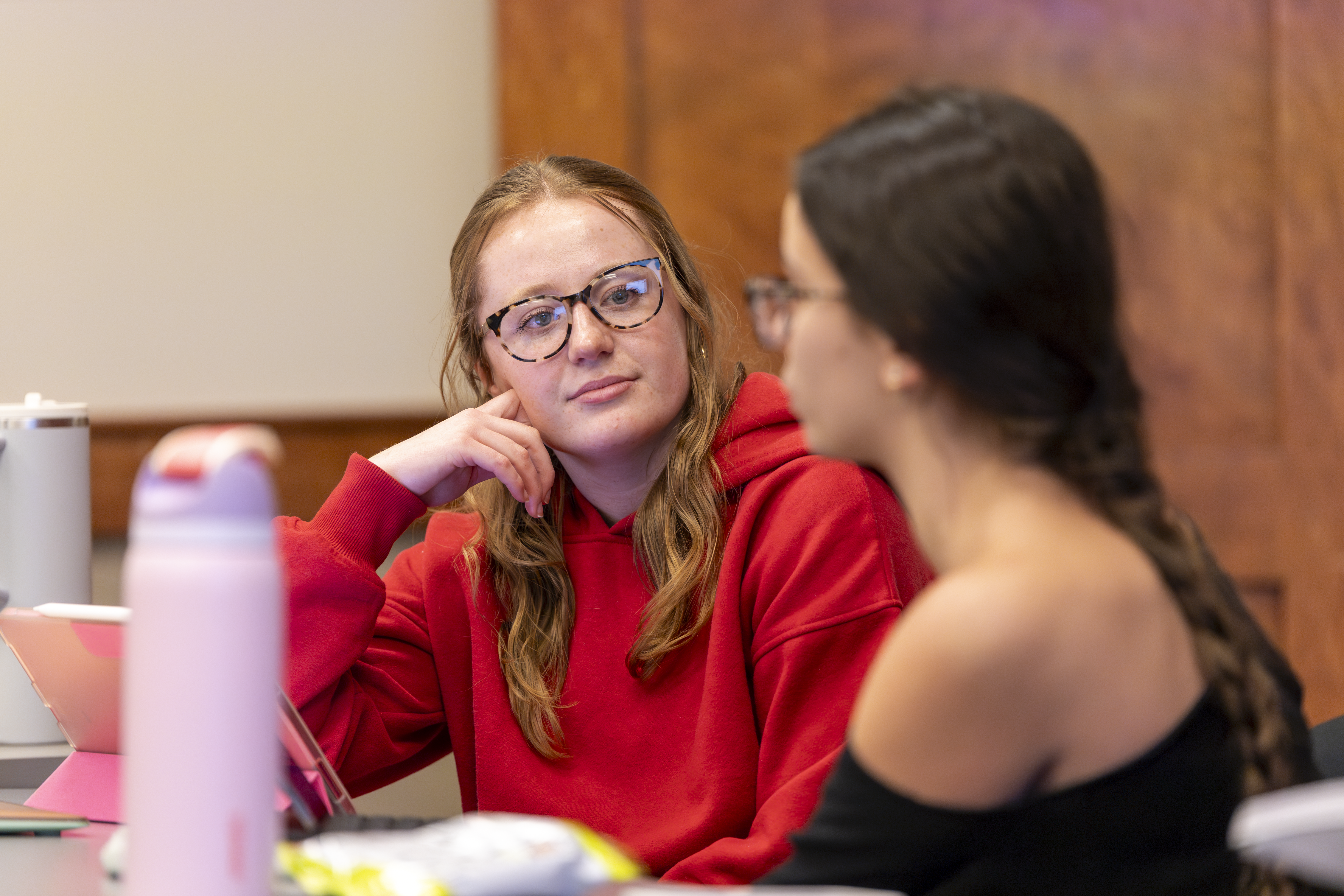 Girl looking another female student