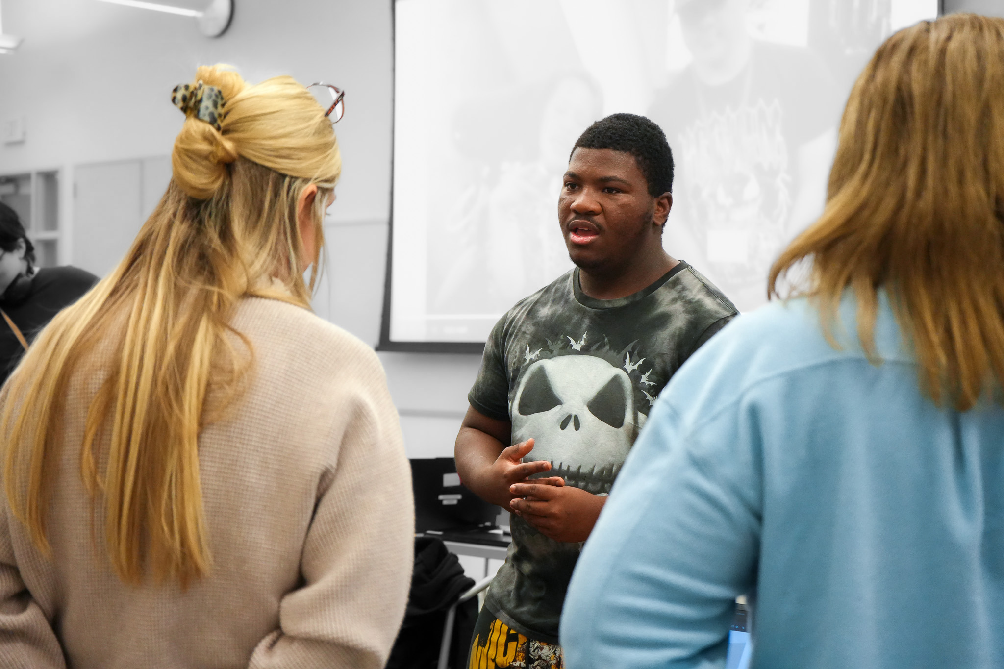 African American student presenting in classroom