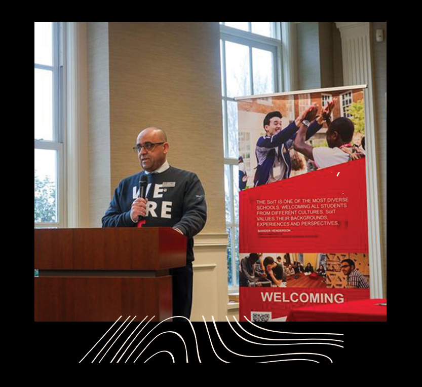 Director of IT speaking in front of a podium