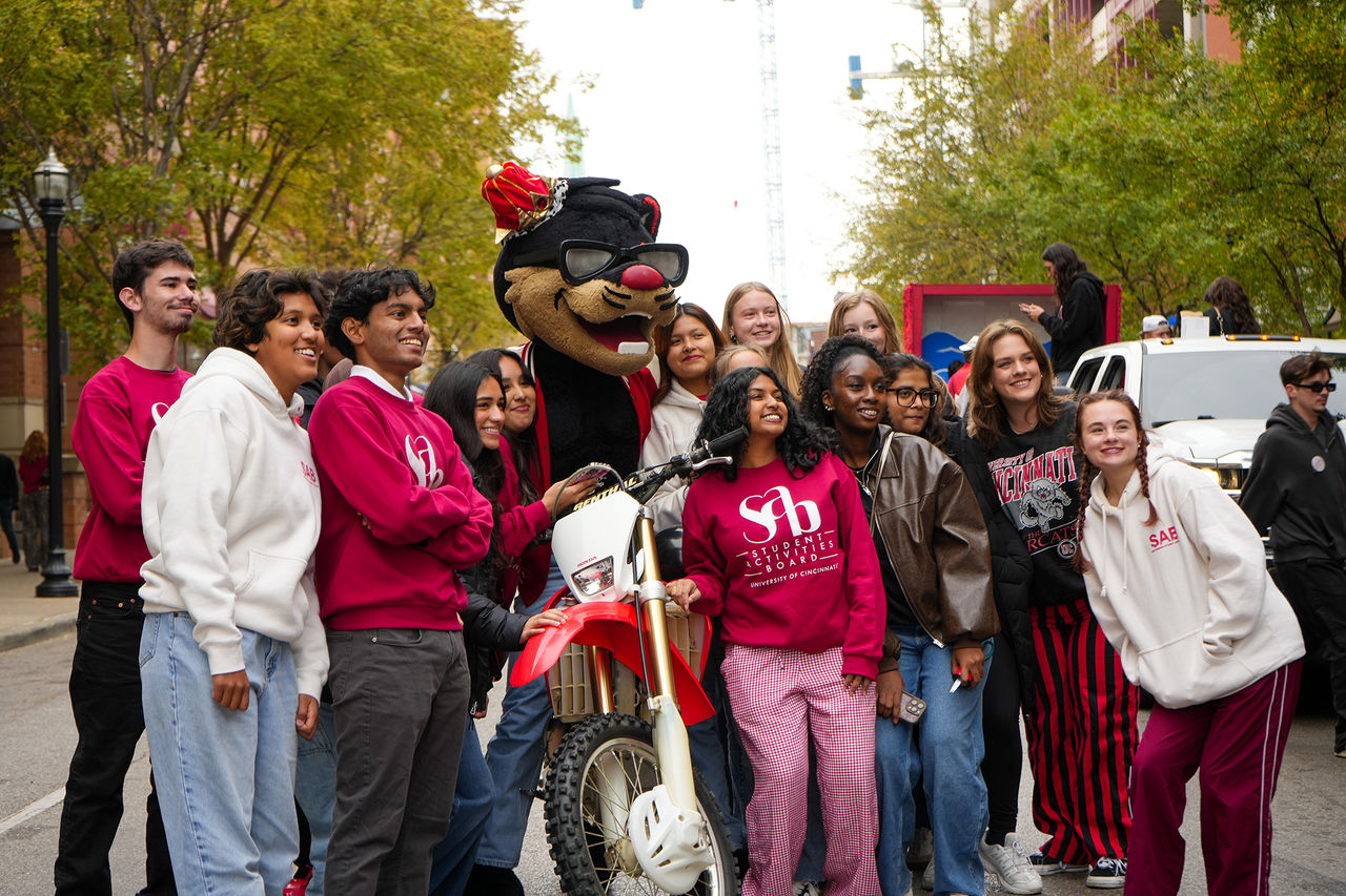 Students with UC Bearcat and Homecoming Game