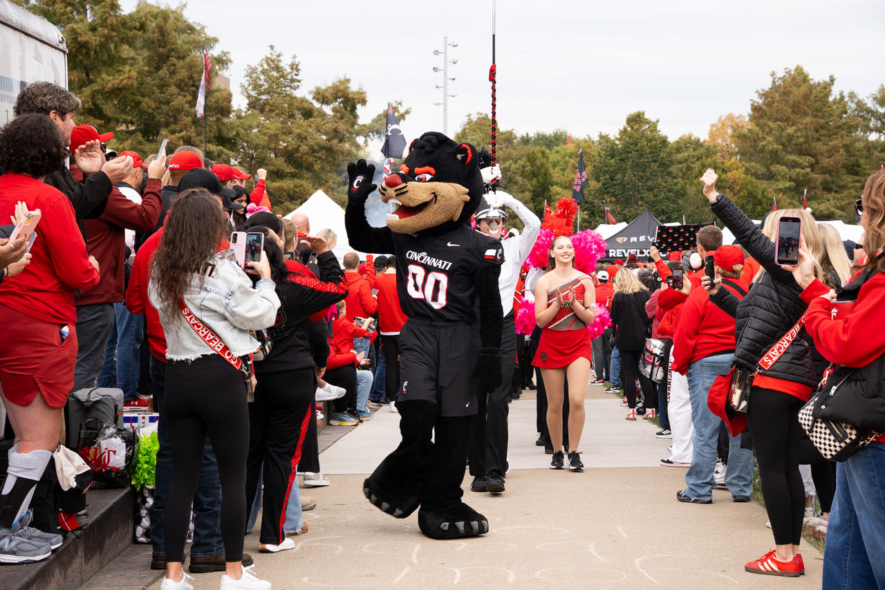 Bearcat Mascot waving to students at homecoming