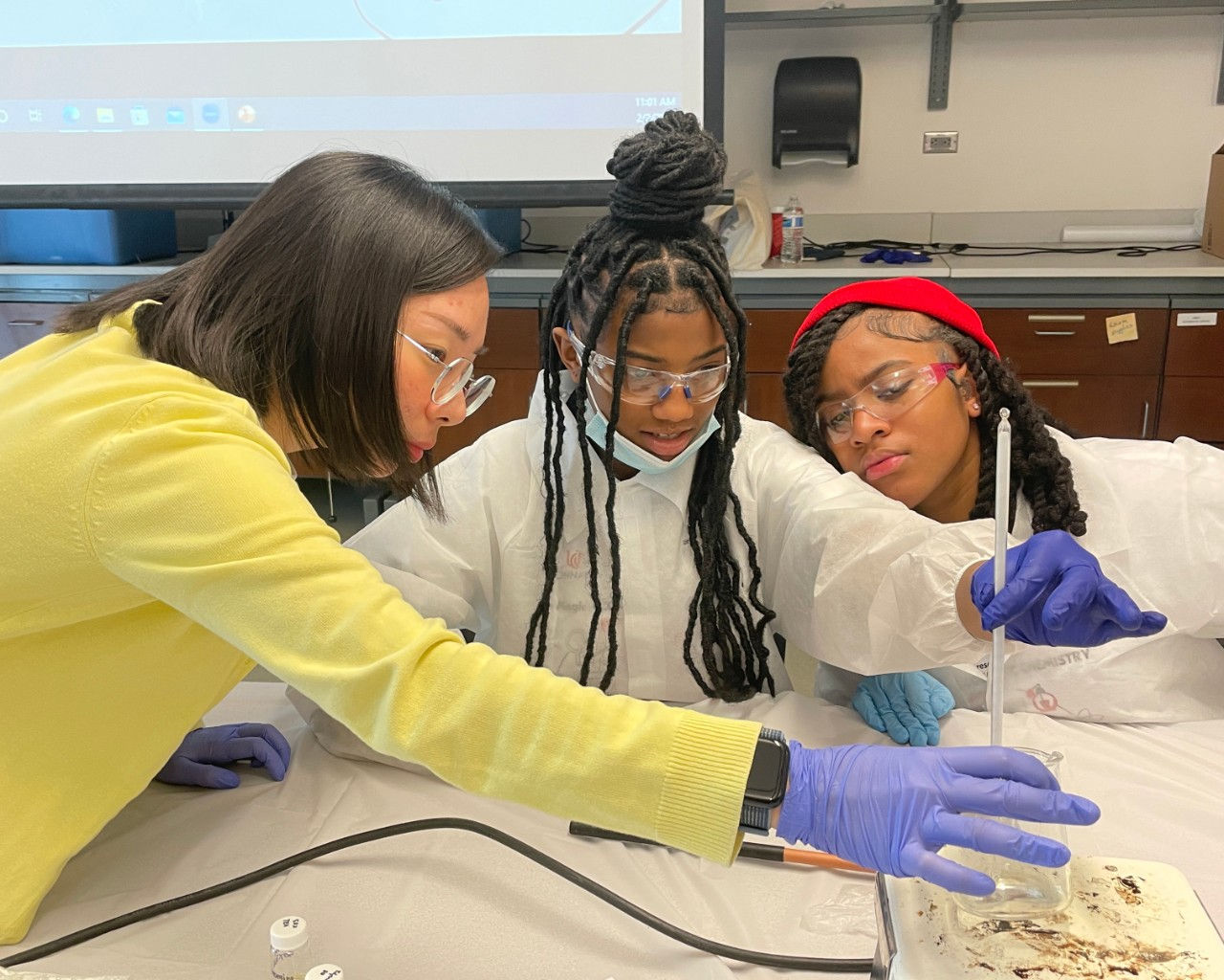 Student being a mentor in Bearcats Academy